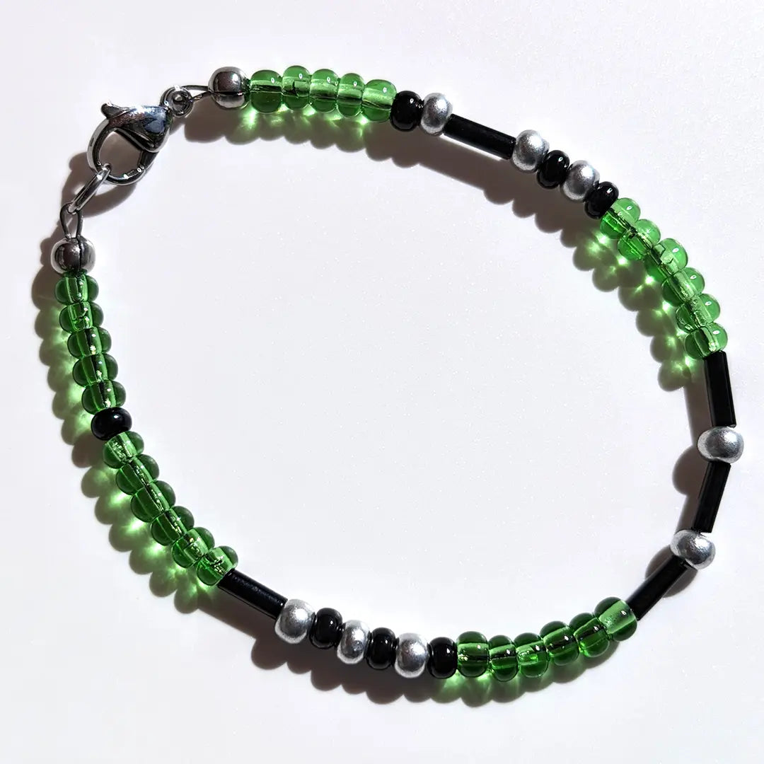 Tranquil Limeade Shimmer Morse code bracelet, handcrafted with lush, calming green & silver Czech glass beads, holds the secret message “Love.”