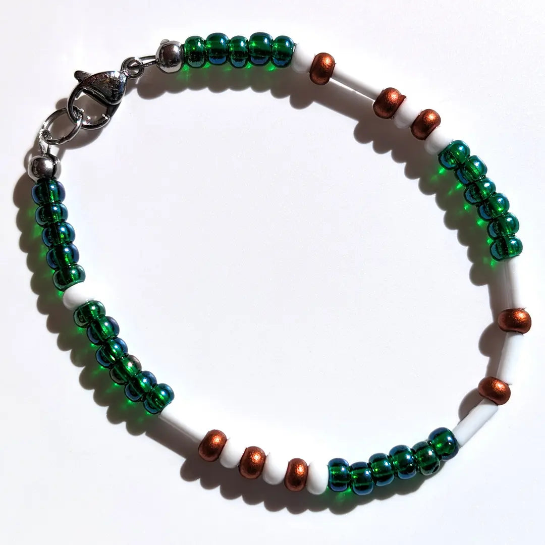 Mesmerizing Mermaid Luster Morse code bracelet, handcrafted with serene blue-green & copper Czech glass beads, holds the secret message “Love.”