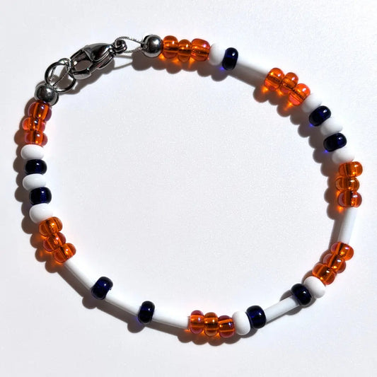 Cheer on the Houston Astros with this Morse code bracelet, handcrafted with 100% stainless steel coupled with dark blue and orange Czech glass beads.