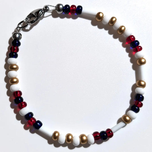 Cheer on the Atlanta Braves with this Morse code bracelet, handcrafted with 100% stainless steel coupled with gold, red, and dark blue Czech glass beads.