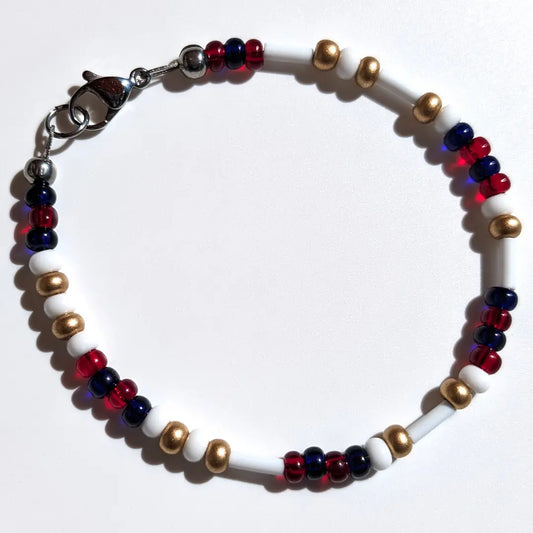 Cheer on the St. Louis Cardinals with this Morse code bracelet, handcrafted with 100% stainless steel coupled with gold, red, and dark blue glass beads.