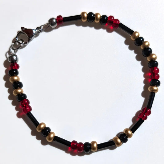 Cheer on the Arizona Diamondbacks with this Morse code bracelet, handcrafted with 100% stainless steel coupled with black, gold, and red Czech glass beads.