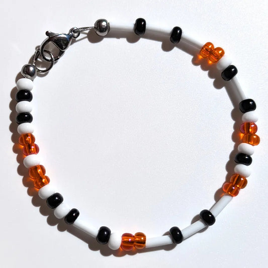 Cheer on the Baltimore Orioles with this Morse code bracelet, handcrafted with 100% stainless steel coupled with black and orange Czech glass beads.
