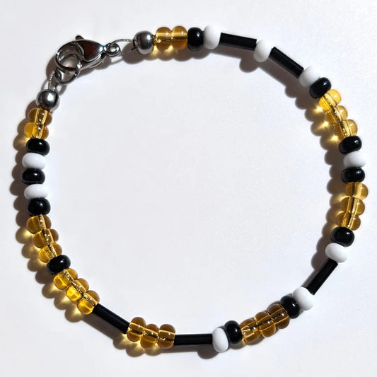 Cheer on the Pittsburgh Pirates with this Morse code bracelet, handcrafted with 100% stainless steel coupled with black, white, and yellow glass beads.