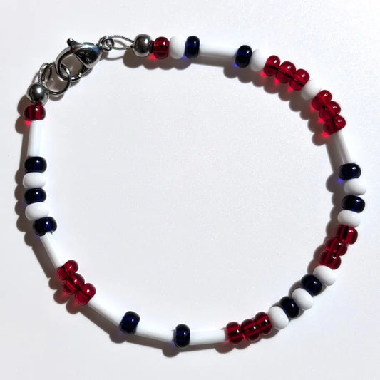 Cheer on the Boston Red Sox with this Morse code bracelet, handcrafted with 100% stainless steel coupled with dark blue and red Czech glass beads.