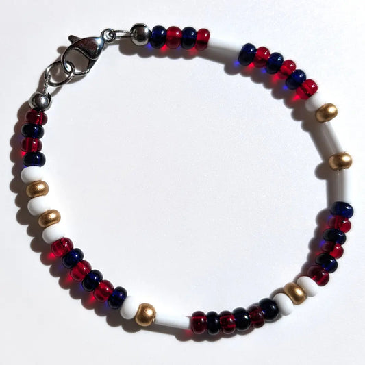 Cheer on the Minnesota Twins with this Morse code bracelet, handcrafted with 100% stainless steel coupled with gold, dark blue, and red Czech glass beads.