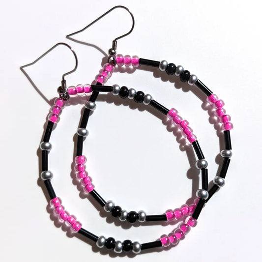 Playful Bubblegum Shimmer Morse code earrings, handcrafted with fun and flirty pink & silver Czech glass beads, hold the secret message “XOXO.”