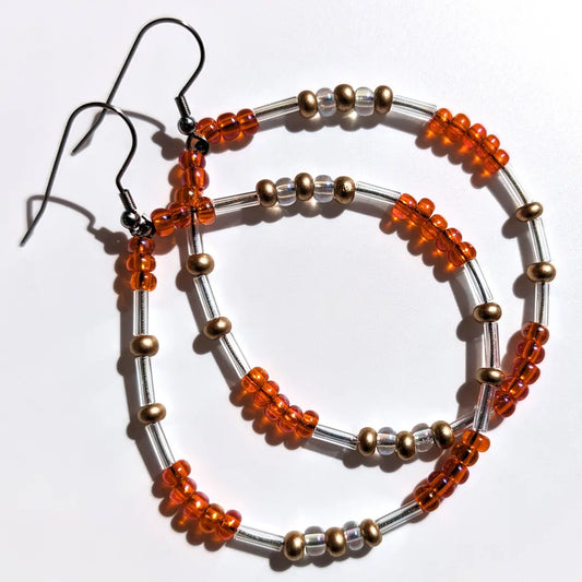 Energetic Tangerine Glitter Morse code earrings, handcrafted with warm, sun-kissed orange & gold Czech glass beads, holds the secret message “Love.”