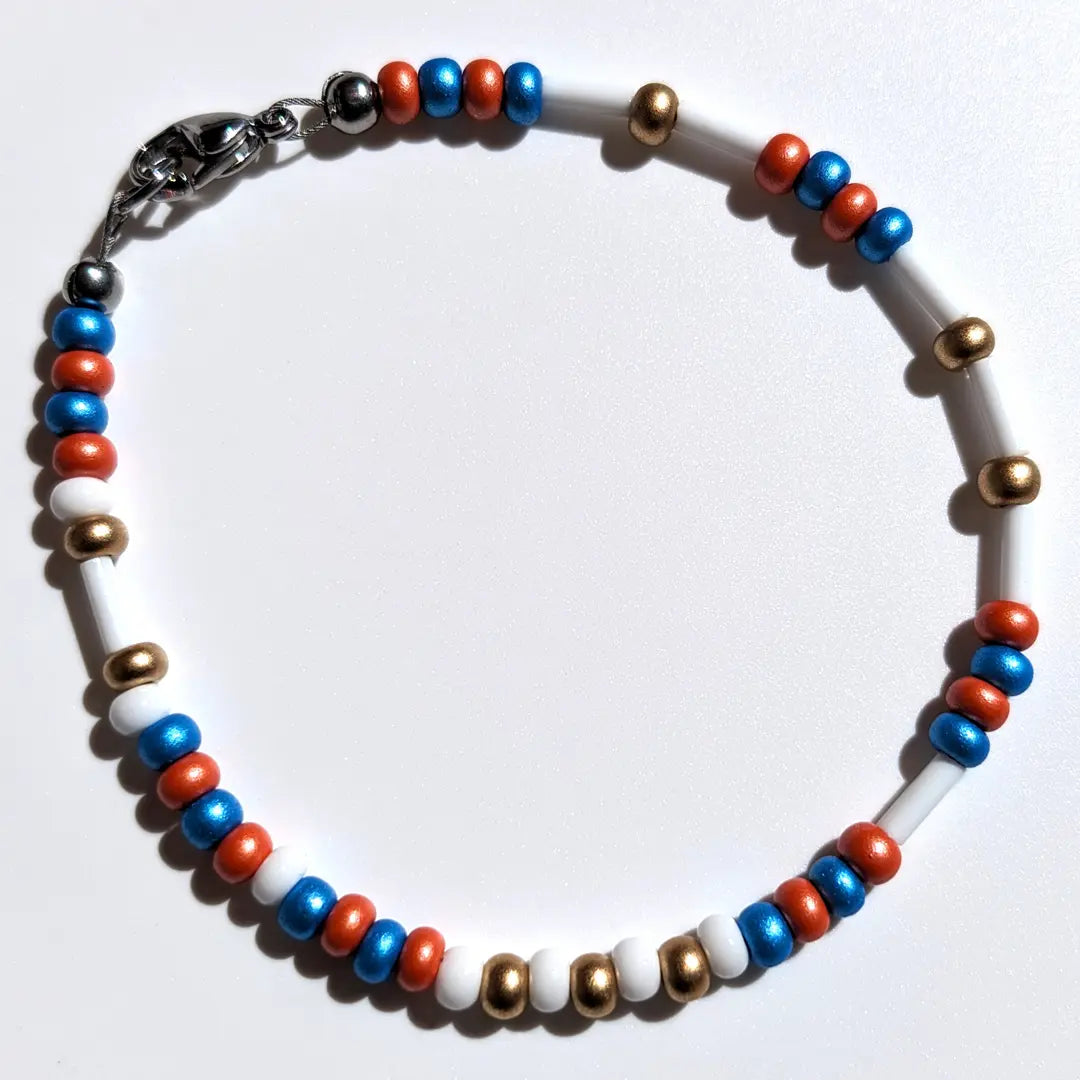 One of our Mother's Day Morse code bracelets customized with limited time Iris & Marigold floral beads.