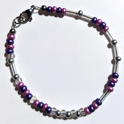 One of our Mother's Day Morse code bracelets customized with limited time Lilac & Lavender floral beads.