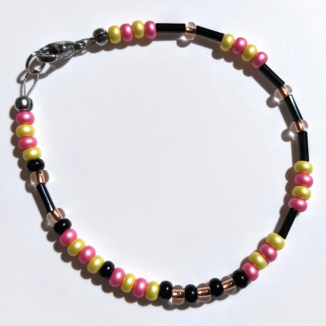 One of our Mother's Day Morse code bracelets customized with limited time Tulip & Daffodil floral beads.